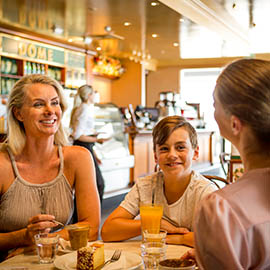 A family sharing a meal at a local cafe